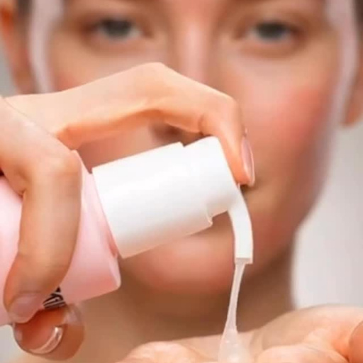 Pumping liquid cleanser onto palm 